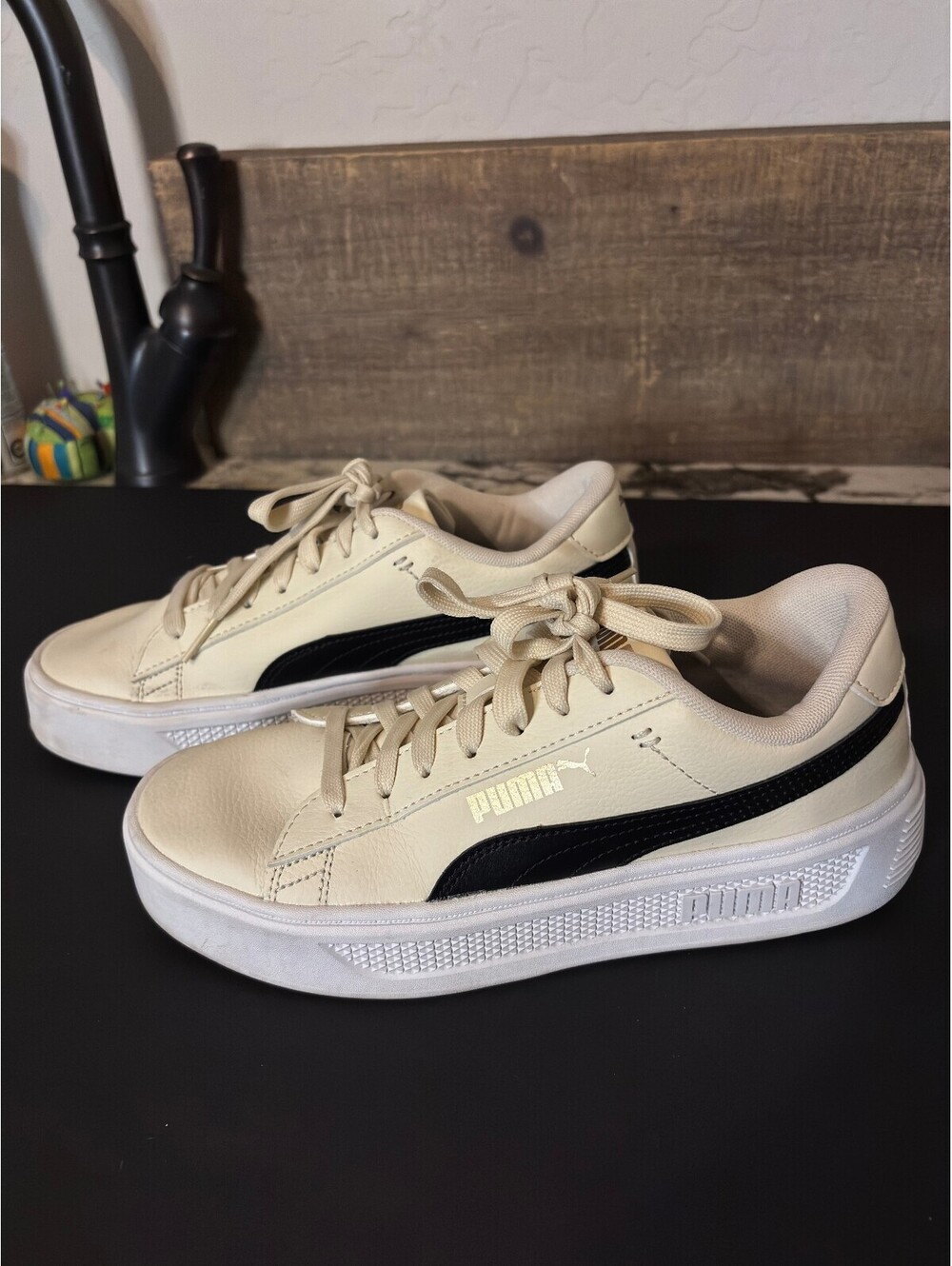 Puma cream leather low top sneakers with black stripe